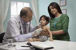 doctor checks baby